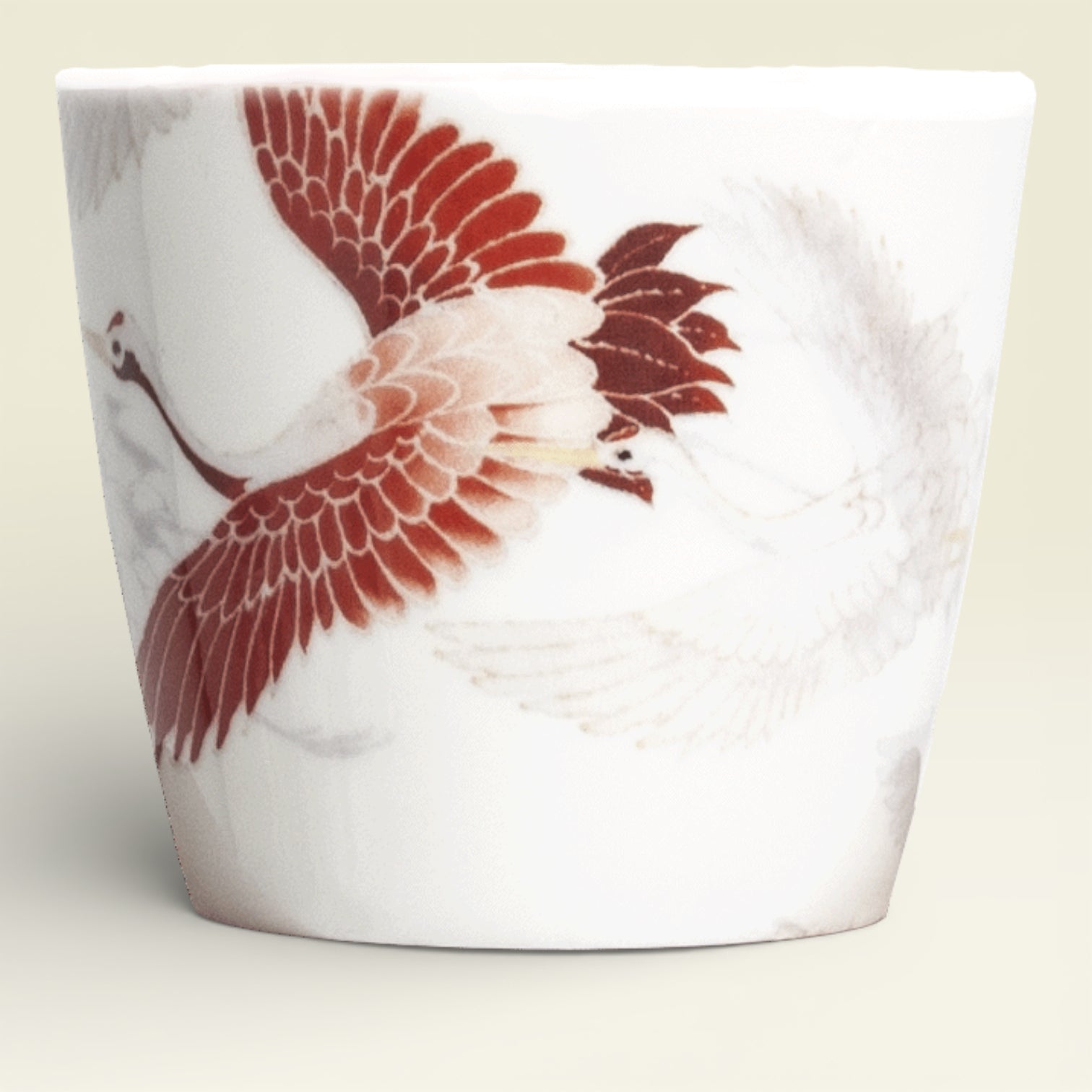 Tekop med trane motiv